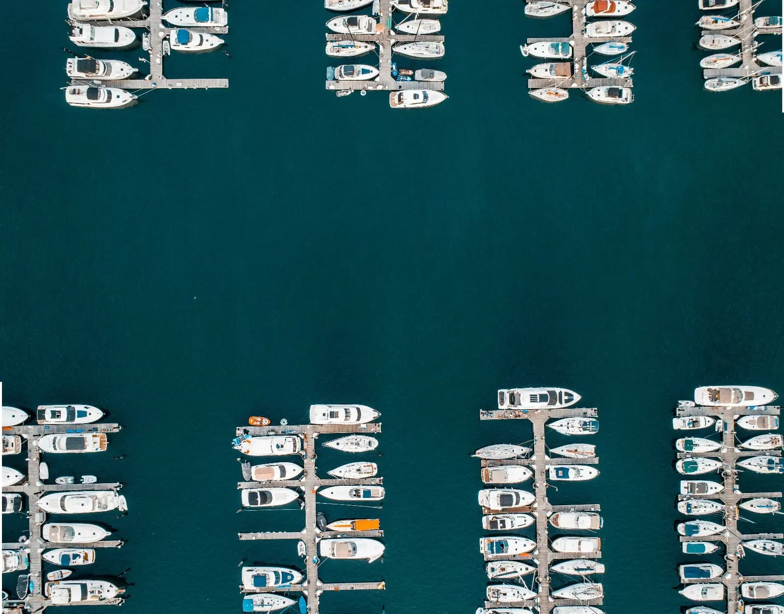 Aerial view of a UK marina with pontoon berths and moored yachts